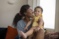 Mother with baby daughter at home