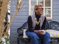 Woman relaxing on bench in backyard