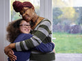 Mother hugging daughter with Down Syndrome