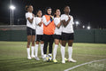 Team of female soccer players standing in row