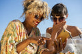 Female couple looking at phone
