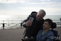 Father and son taking selfie by the sea