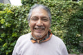Portrait of smiling senior man outdoors