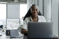 Businesswoman attending video conference in office