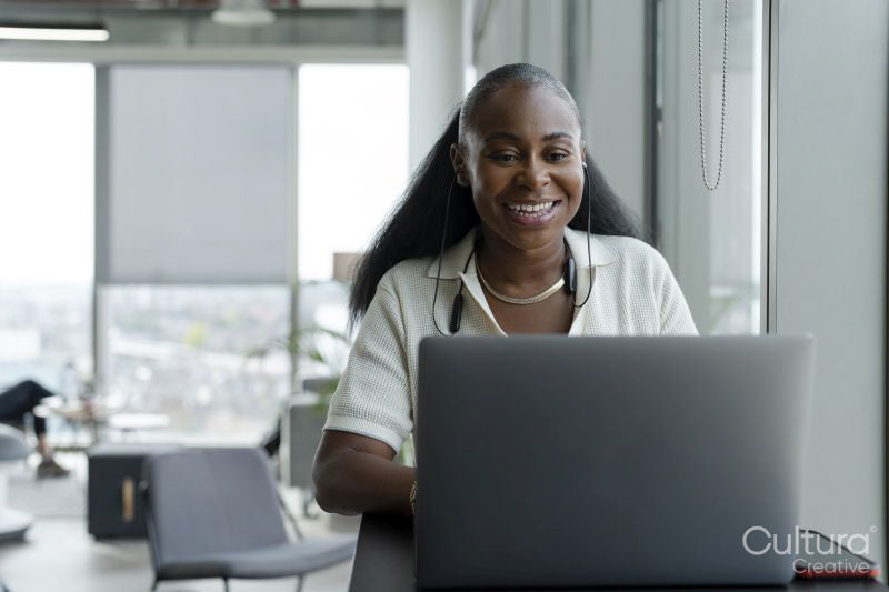 Businesswoman attending video conference in office