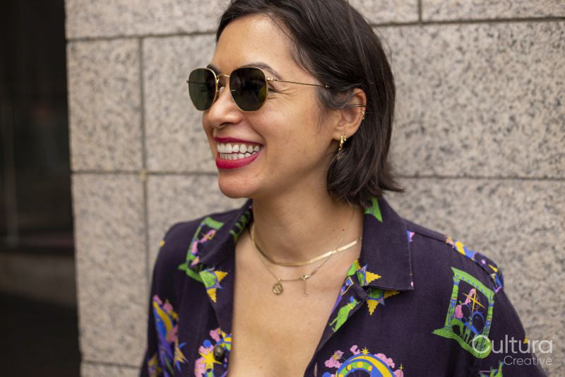 Portrait of mid adult woman wearing sunglasses