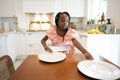 Girl putting plates on table
