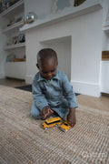 Boy playing with toy cars