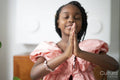 Smiling girl praying