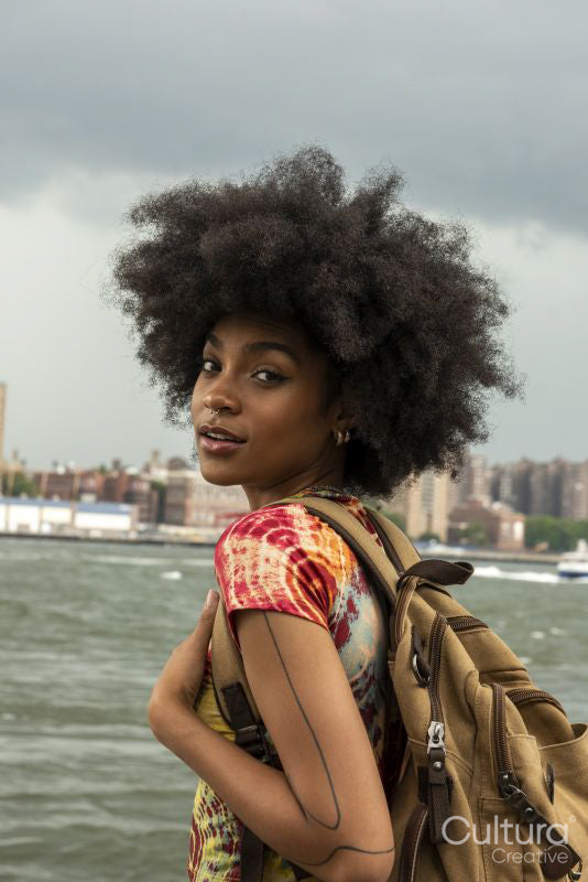 Portrait of young woman with backpack