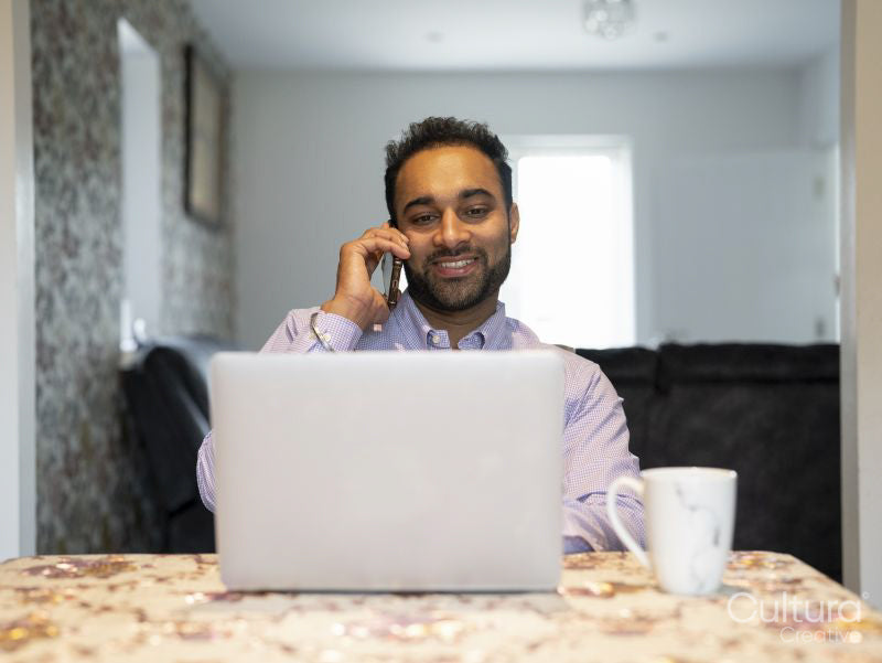 Man working on laptop from home