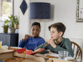 Boys eating pizza at home