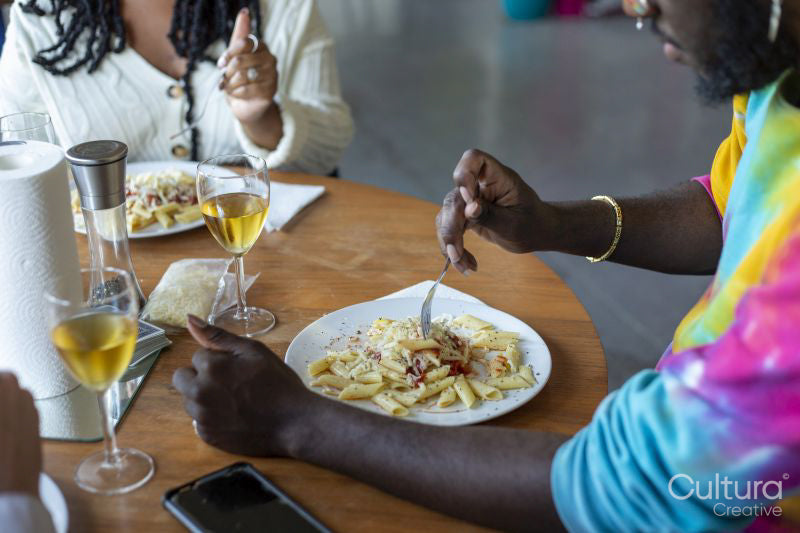 People having pasta at home