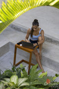 Woman sitting in hotel lounge and using laptop