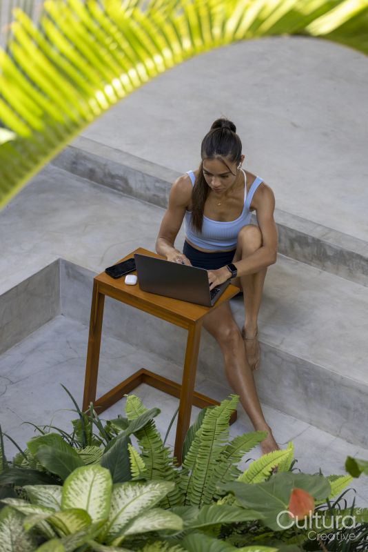 Woman sitting in hotel lounge and using laptop