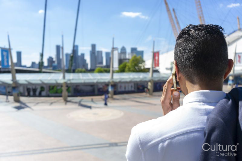 Businessman talking on phone outdoors