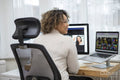 Smiling woman having video conference at home