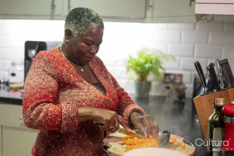 Senior woman preparing food in kitchen