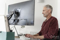 Mature man working on computer at home