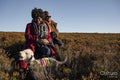 Two senior women with dog in moorland