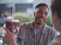 South Yorkshire, couple toasting with cocktails at restaurant table