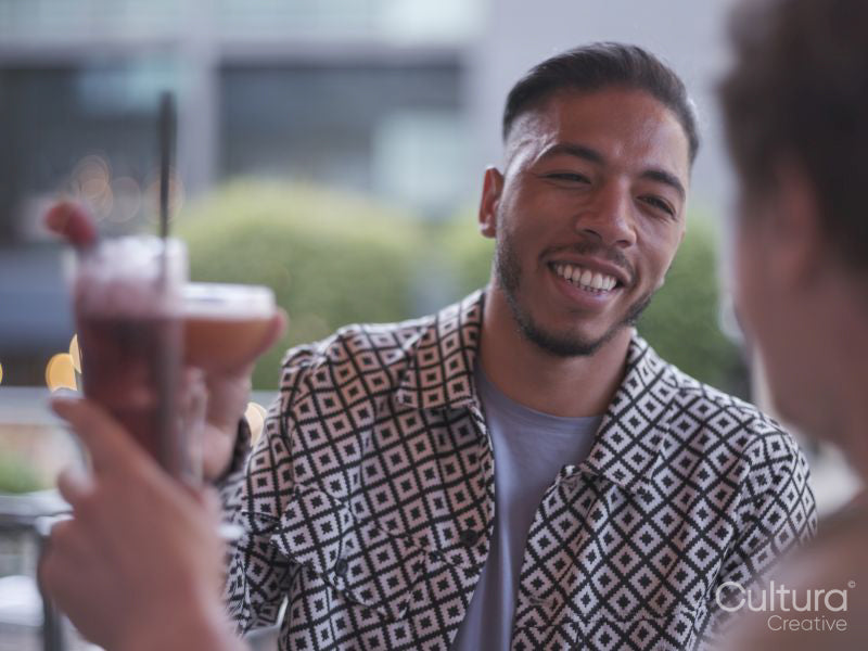 South Yorkshire, couple toasting with cocktails at restaurant table