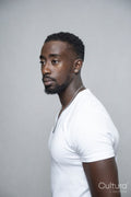 Portrait of man wearing white t-shirt and necklace