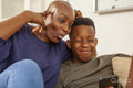 Mother and son taking selfie and making faces