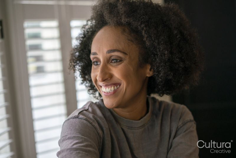 Portrait of smiling woman at home