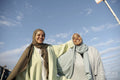 Portrait of smiling Muslim women looking at camera on sunny day