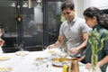 Husband and wife putting food on plates