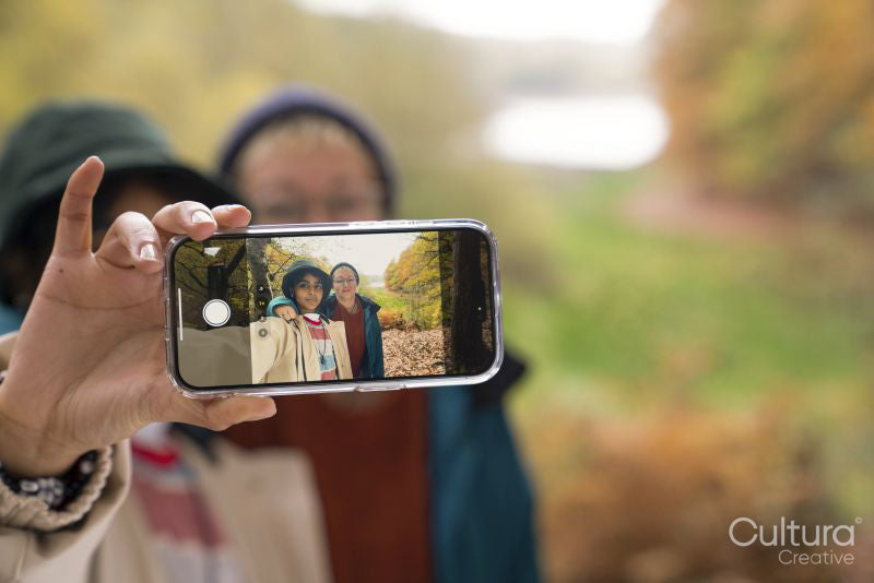 Female friends taking selfie while hiking