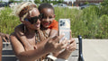 Smiling mother and son taking selfie outdoors