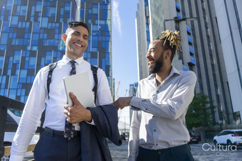 Two businessmen walking in business district