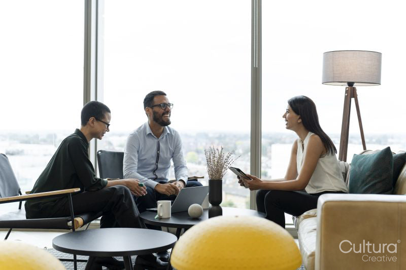 Business people having meeting in office lobby