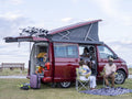 Family camping in camper van