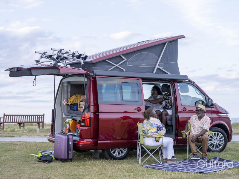 Family camping in camper van