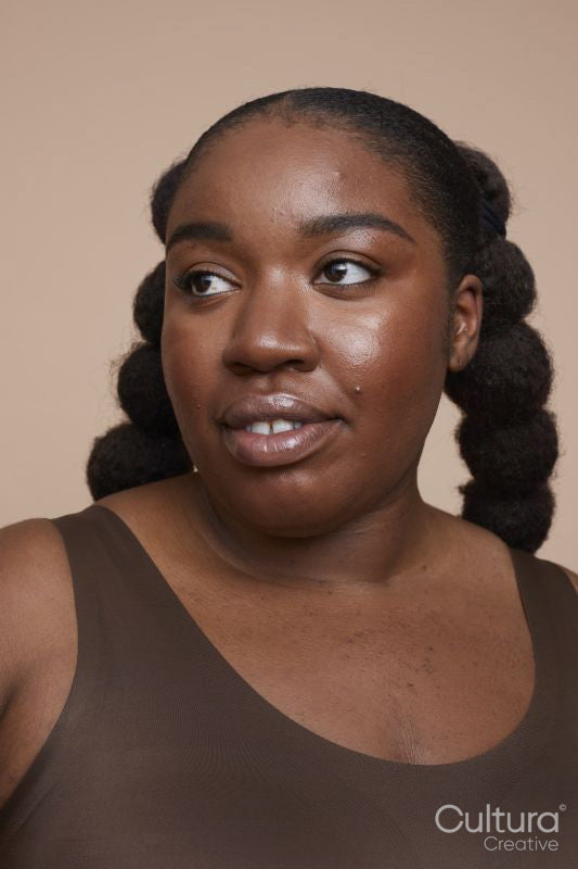 Studio shot of young woman with braided hair