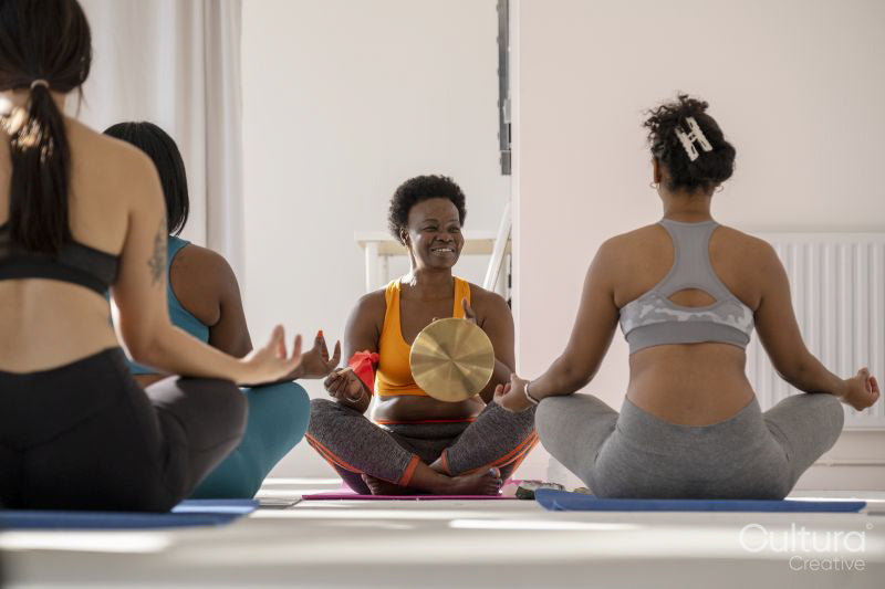 Women meditating in yoga studio
