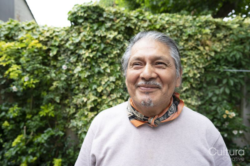Portrait of smiling senior man outdoors