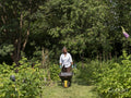 Mature woman gardening in allotment