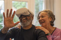 Senior couple having fun with VR set