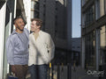 South Yorkshire, Smiling couple walking in city