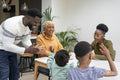 Family with children celebrating birthday at home