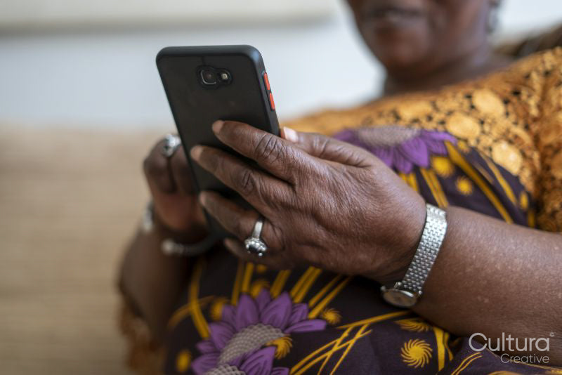 Close-up of senior woman's hands holding smart phone