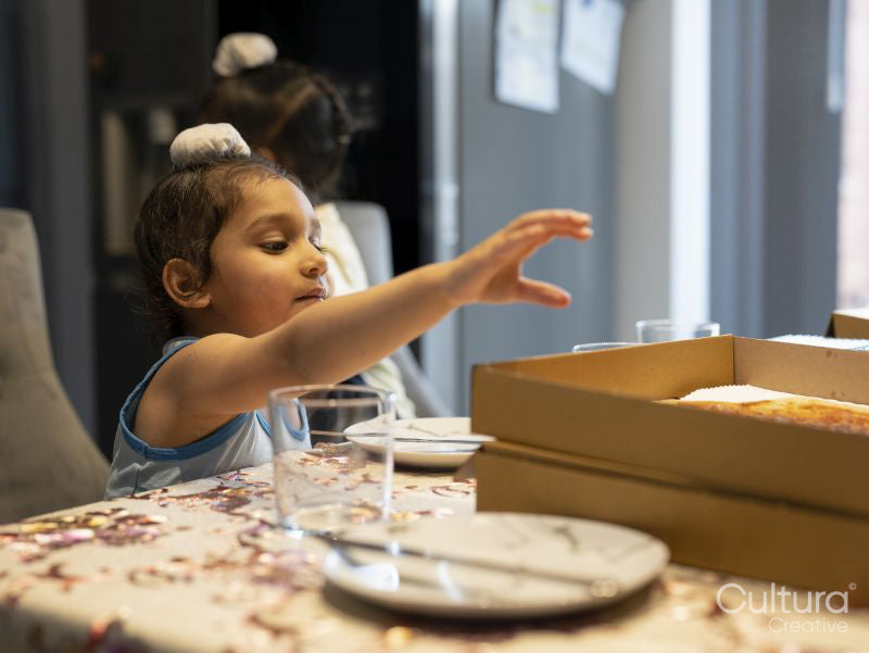 Boy eating pizza at home