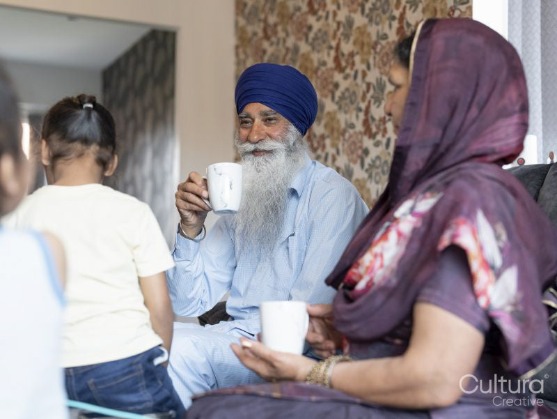 Grandparents and grandson relaxing at home