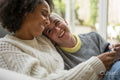Smiling couple looking at baby ultrasound image