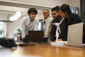 Business people brainstorming over laptop