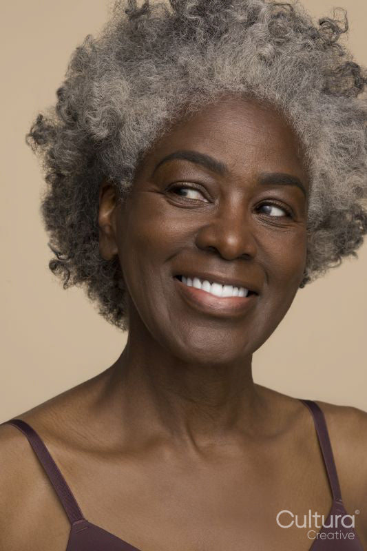 Studio portrait of mature woman